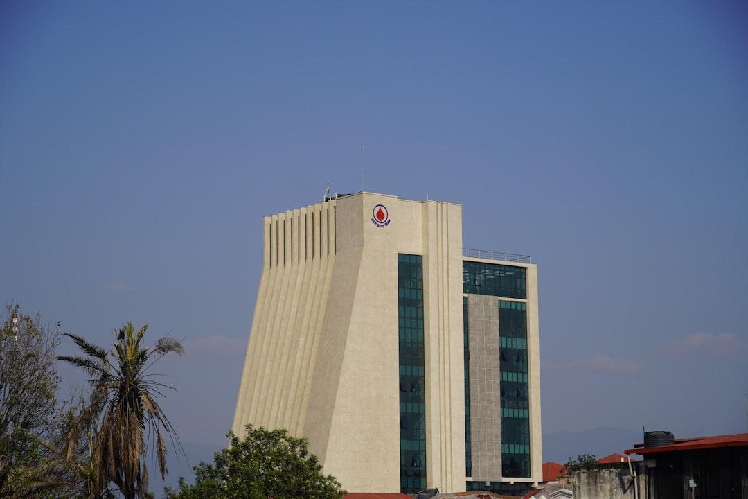 Modern building with geometric design against blue sky