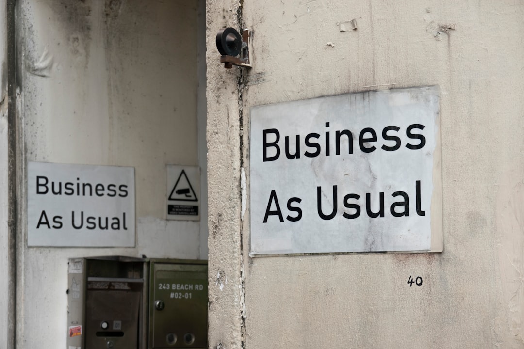 a business as usual sign on a wall