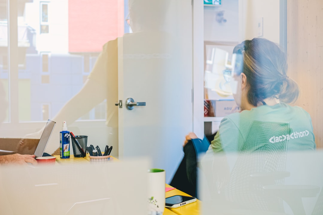 Woman working at a desk through glass