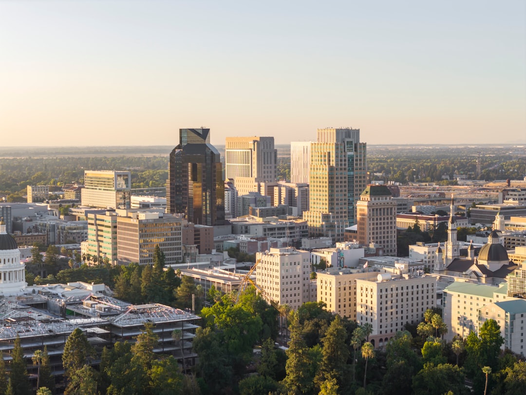 City skyline with modern buildings at sunset.